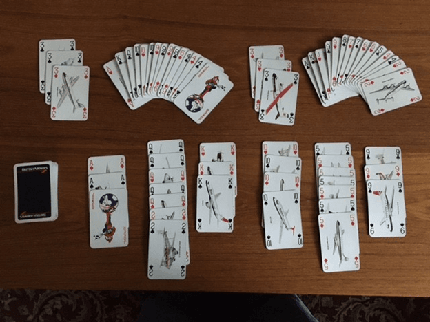Canasta for Two: Deal 15 cards to start. Score threes, red/black canastas, card values.